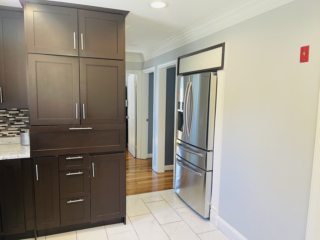 17 Queensview Road Marlborough, MA 01752 - Photo 11 of 41 a kitchen with a refrigerator and cabinets