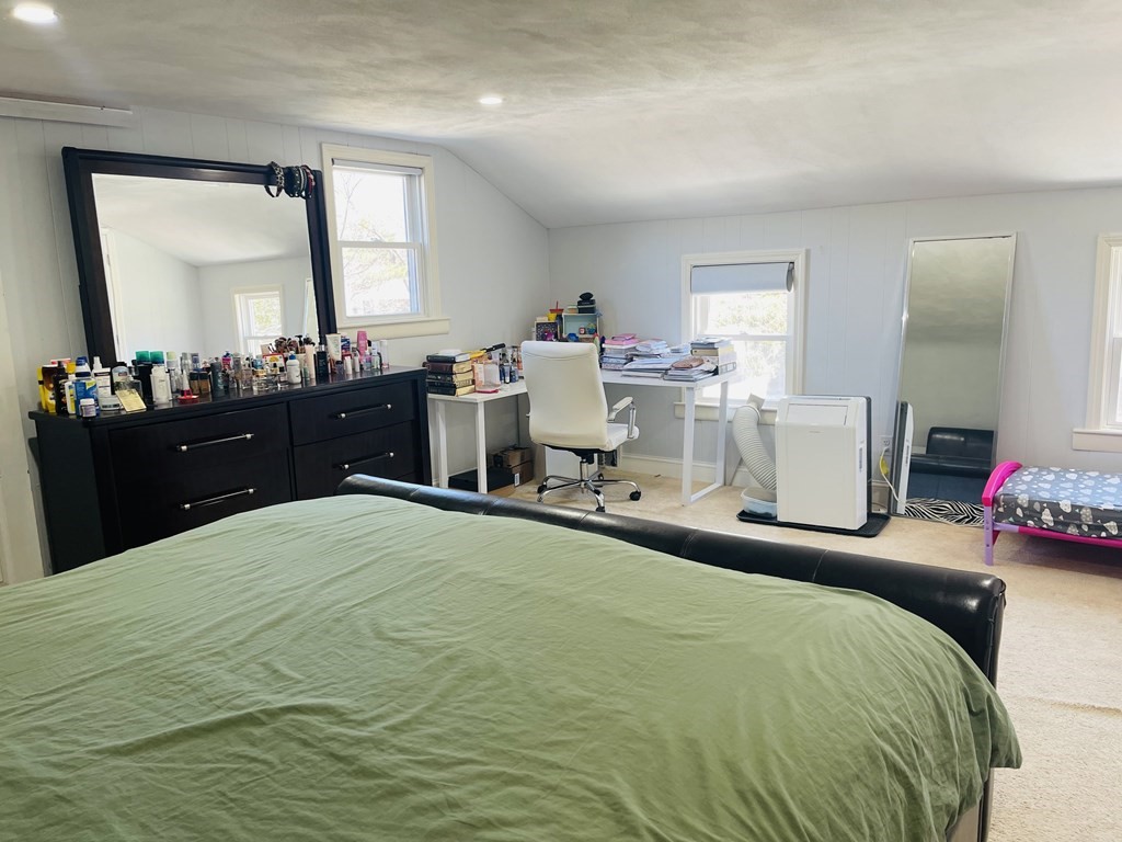 17 Queensview Road Marlborough, MA 01752 - Photo 21 of 41 a bedroom with a bed and a mirror