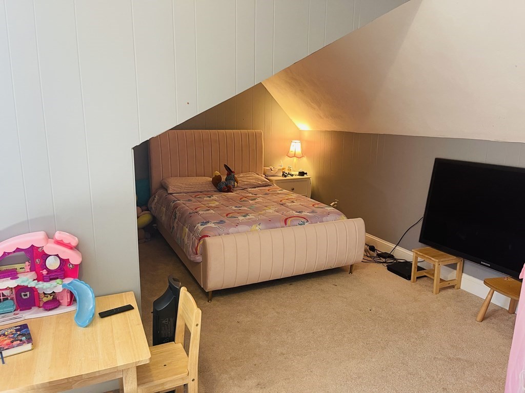 17 Queensview Road Marlborough, MA 01752 - Photo 23 of 41 a bedroom with a bed and flat screen tv