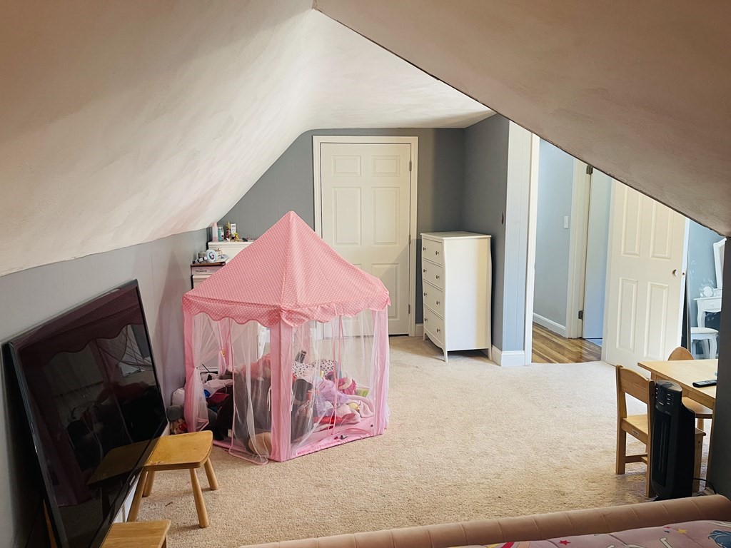 17 Queensview Road Marlborough, MA 01752 - Photo 25 of 41 a bedroom with a bed and a mirror