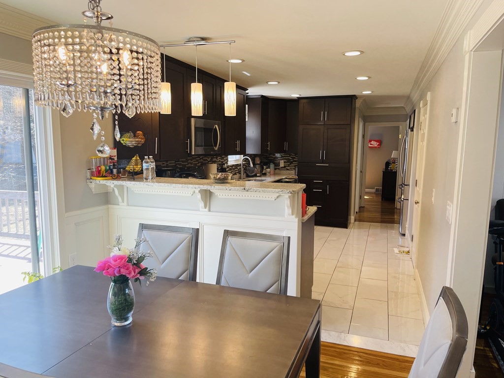17 Queensview Road Marlborough, MA 01752 - Photo 8 of 41 a view of living room filled with furniture and chandelier