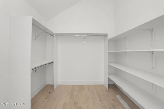 a view of an empty walk in closet