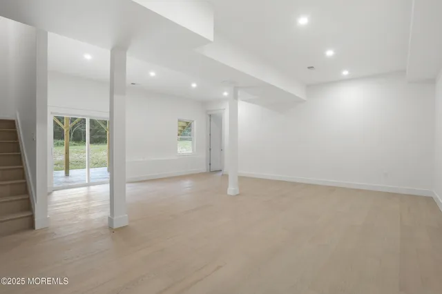 a view of an empty room with glass door