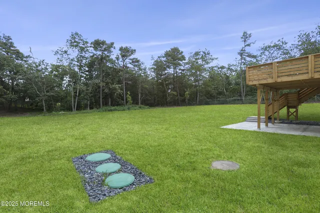 a view of a backyard with a trampoline