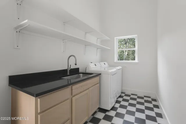 a kitchen with a sink and cabinets