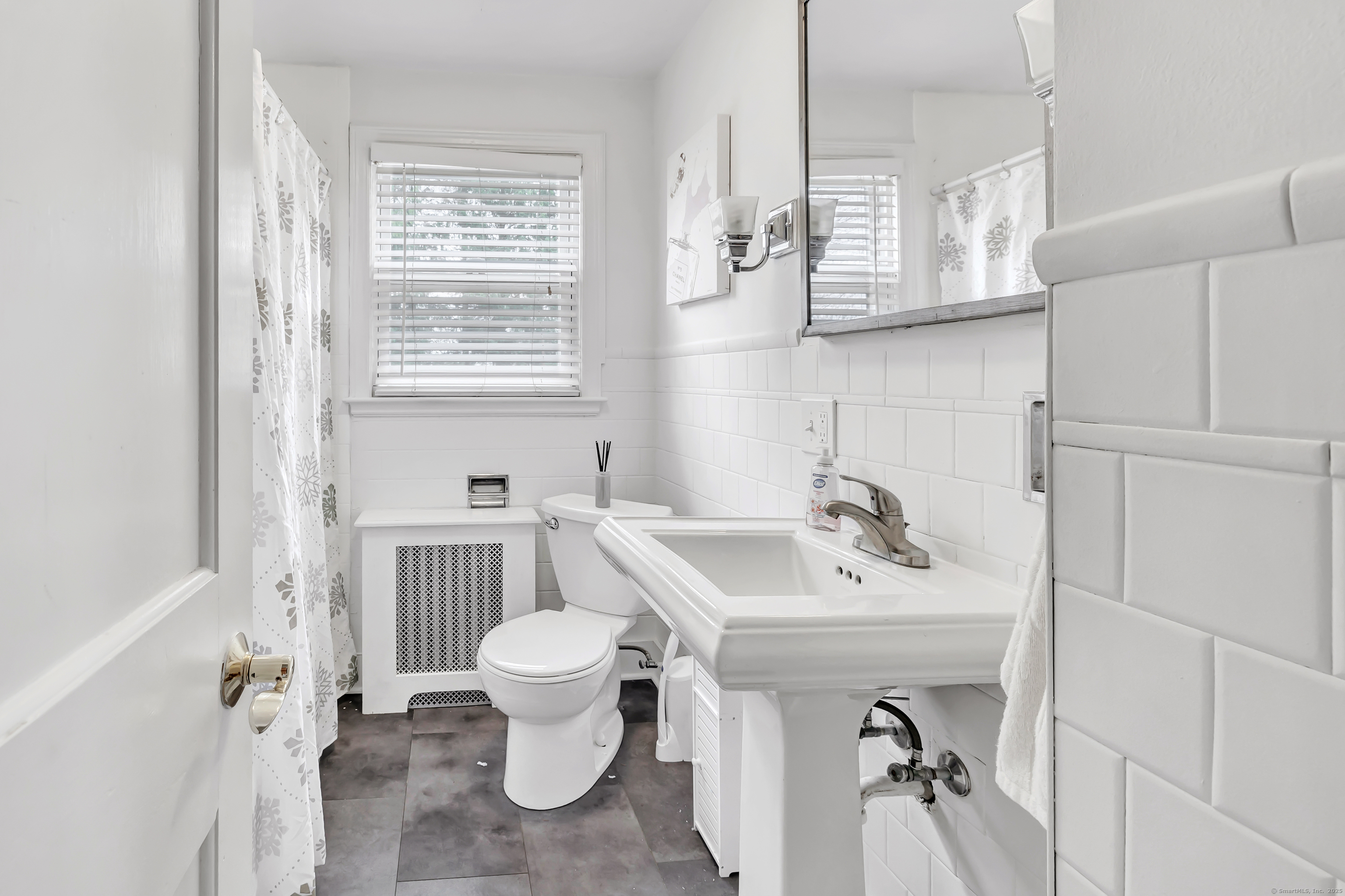 804 Washington Ave Extension Waterbury, CT 06708 - Photo 20 of 35 a bathroom with a sink toilet and a mirror