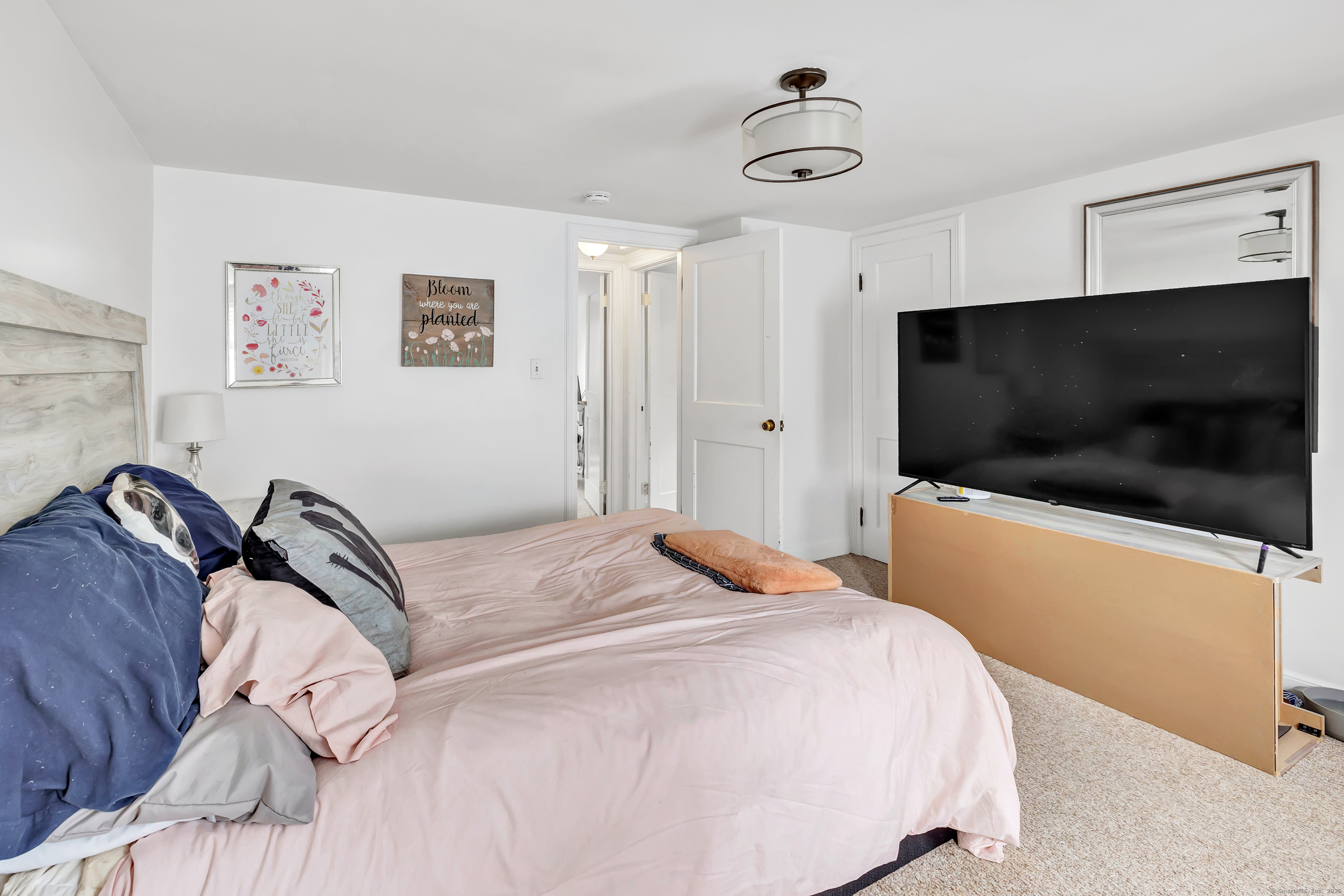 804 Washington Ave Extension Waterbury, CT 06708 - Photo 23 of 35 a bedroom with a bed and a flat screen tv