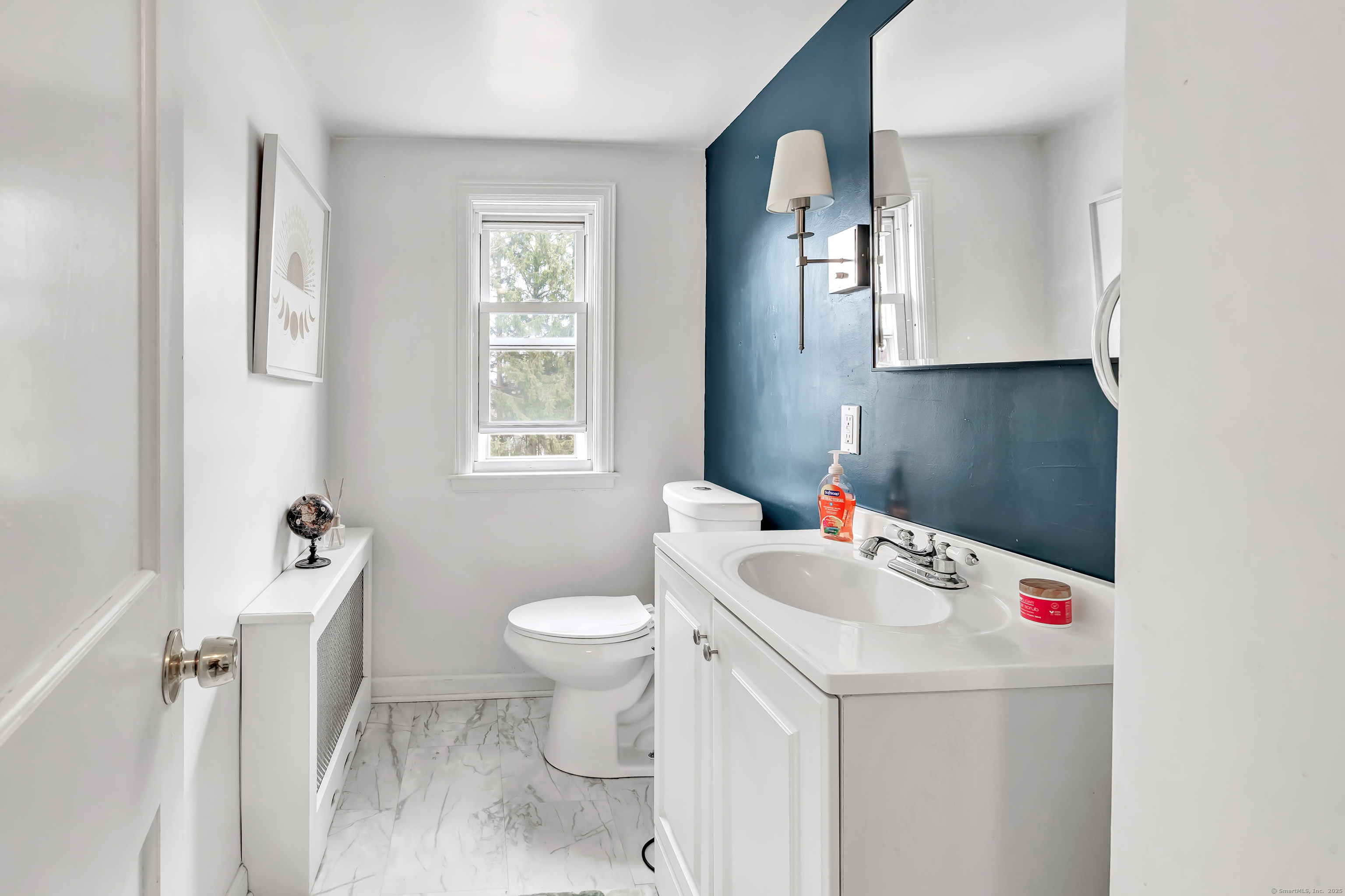 804 Washington Ave Extension Waterbury, CT 06708 - Photo 24 of 35 a bathroom with a sink toilet and mirror