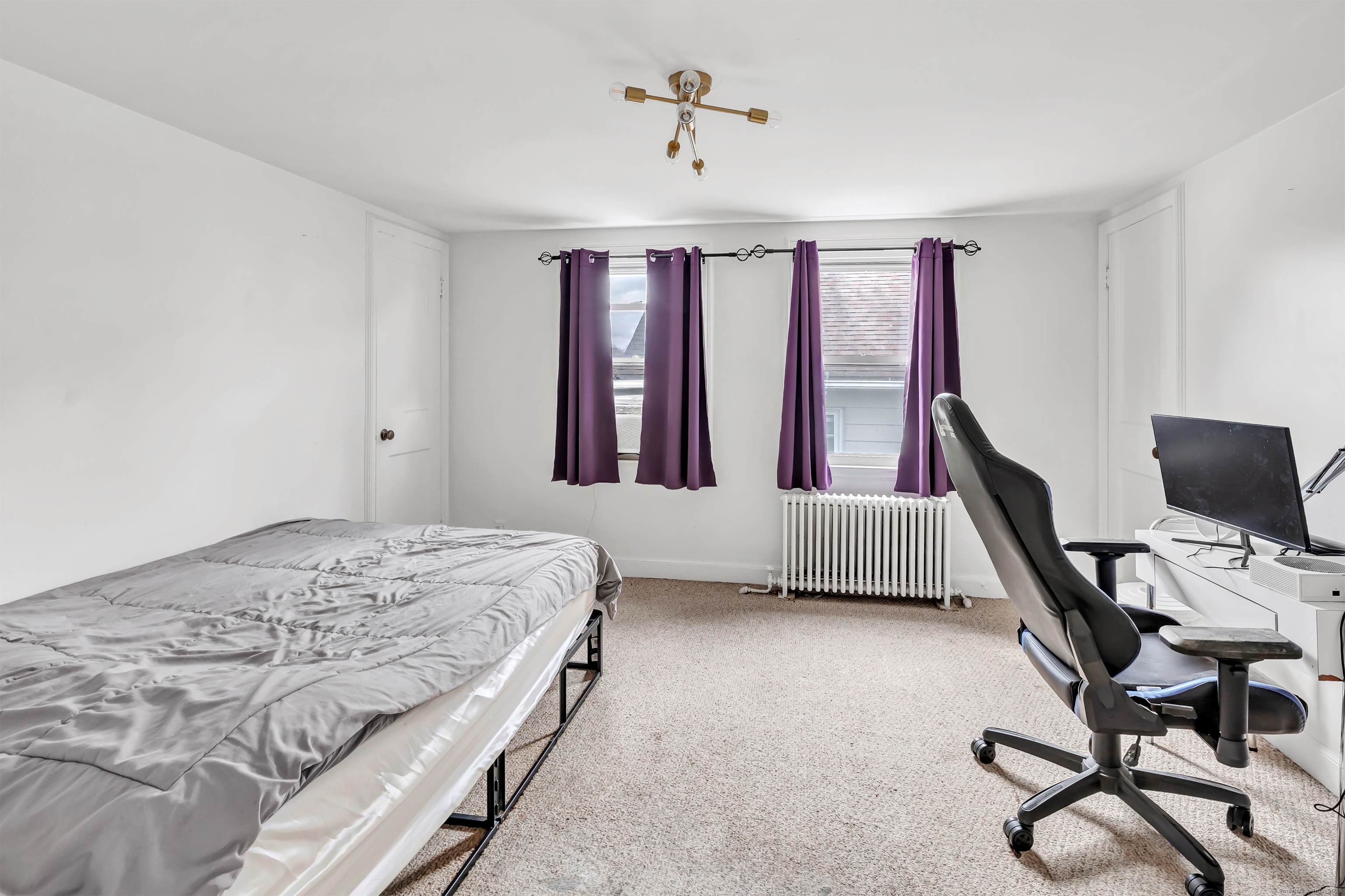 804 Washington Ave Extension Waterbury, CT 06708 - Photo 25 of 35 a bedroom with a bed chairs and a window