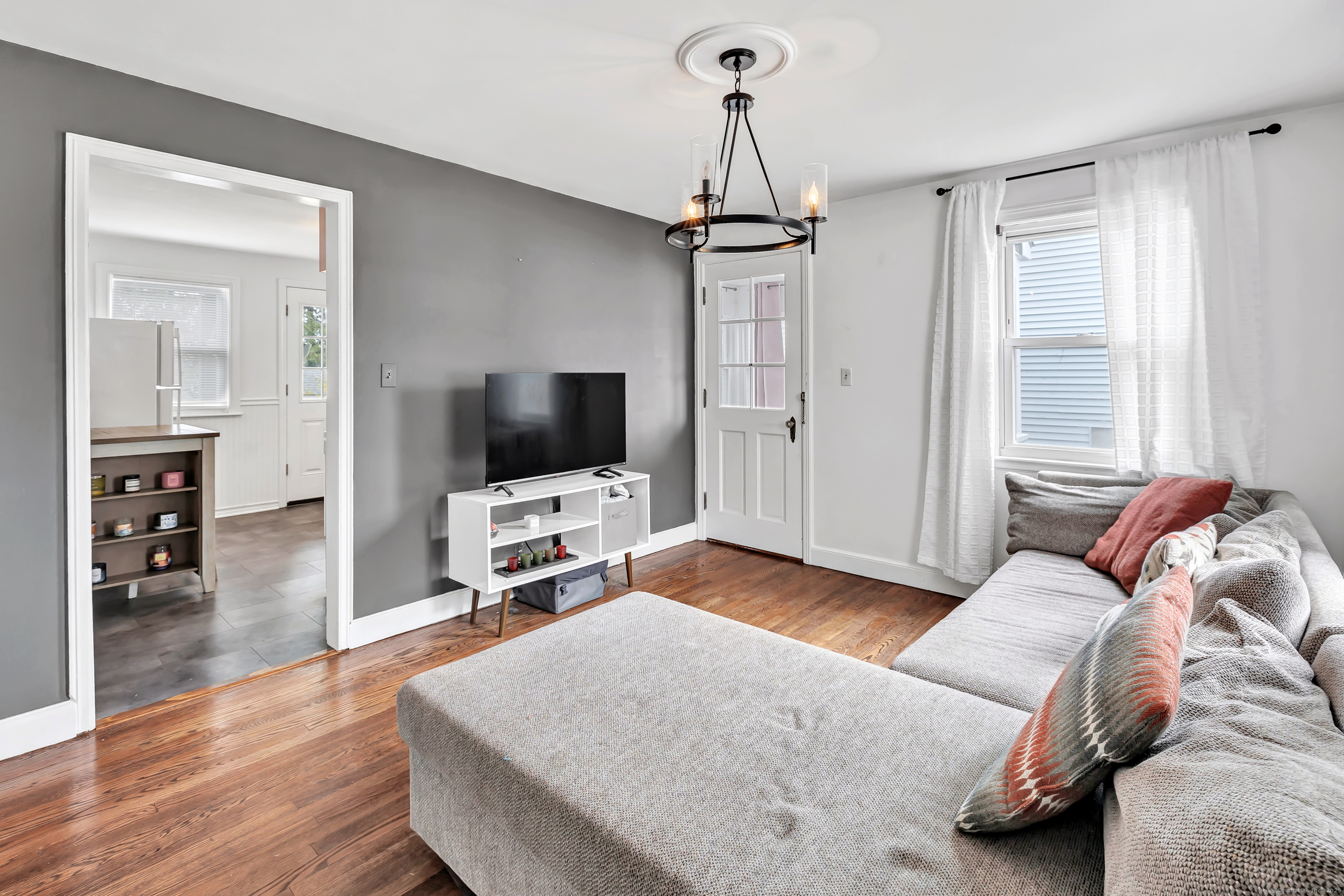 804 Washington Ave Extension Waterbury, CT 06708 - Photo 6 of 35 a living room with furniture and a flat screen tv