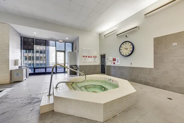 a view of a patio with couches table and chairs and potted plants