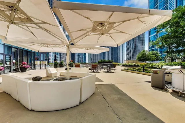 a view of the patio with table and chairs potted plants