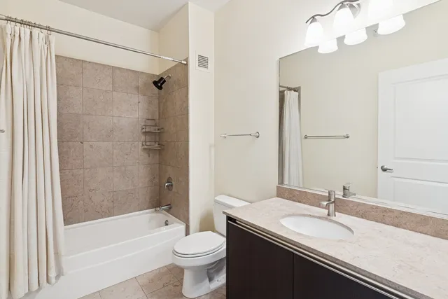 a kitchen with a stove and a refrigerator