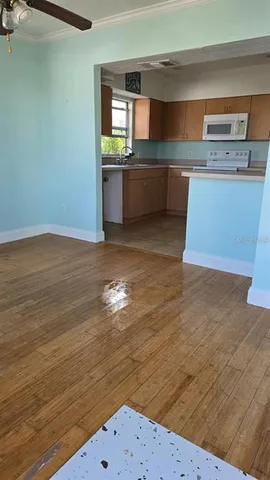 a view of kitchen and wooden floor