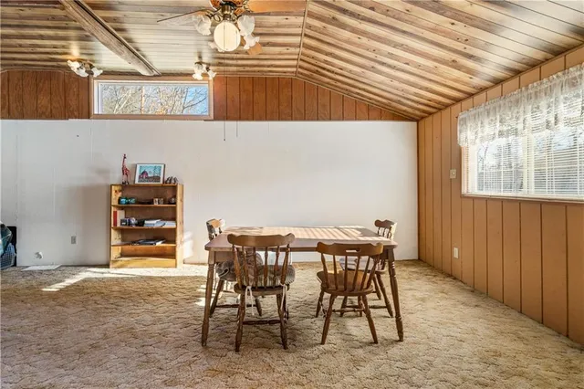 a view of a room with furniture and window