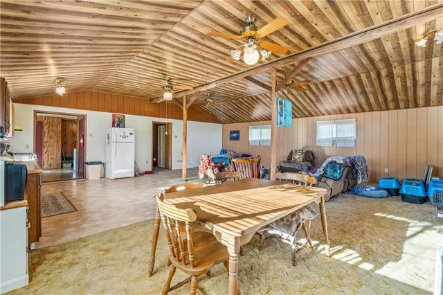 a view of a dinning table and chairs in the patio