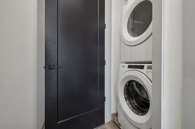 an empty room with staircase and white walls