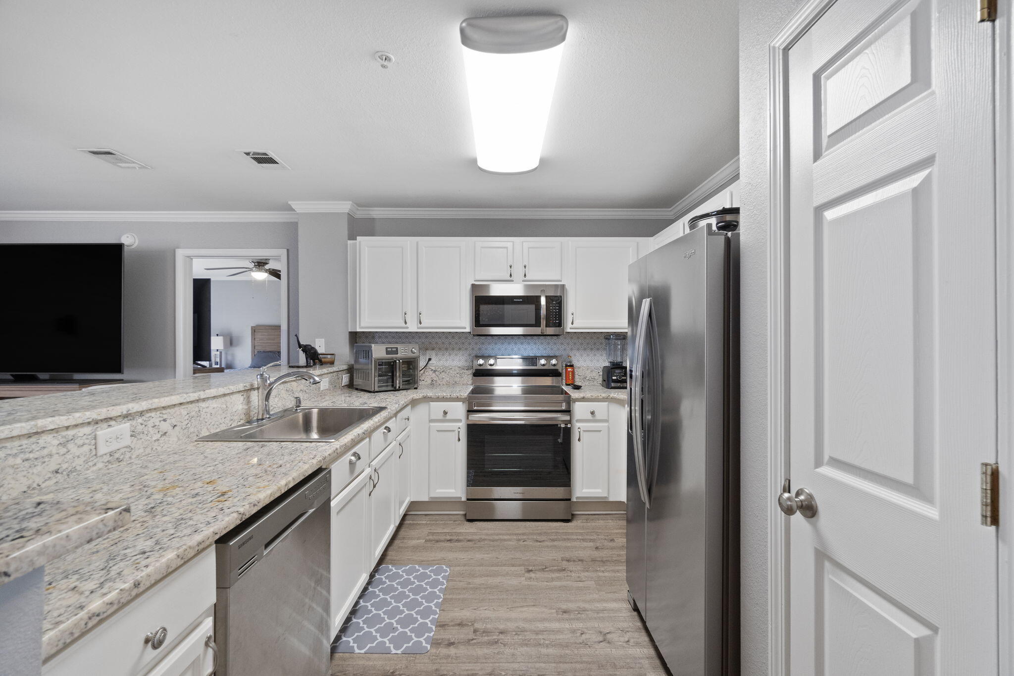 108 Corwin Drive Crestview, FL 32539 - Photo 5 of 20 a kitchen with stainless steel appliances granite countertop a refrigerator and a sink