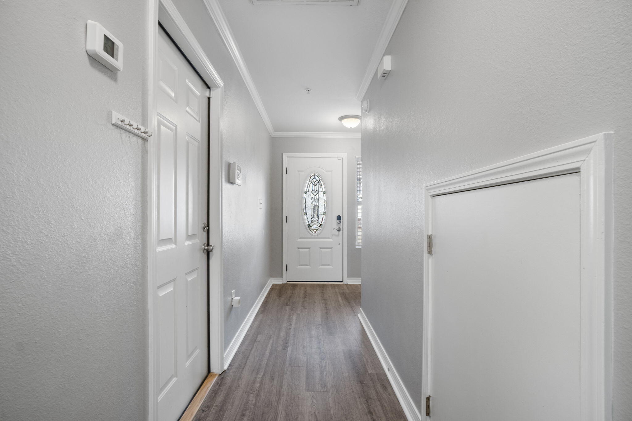 108 Corwin Drive Crestview, FL 32539 - Photo 10 of 20 a view of a hallway with wooden floor