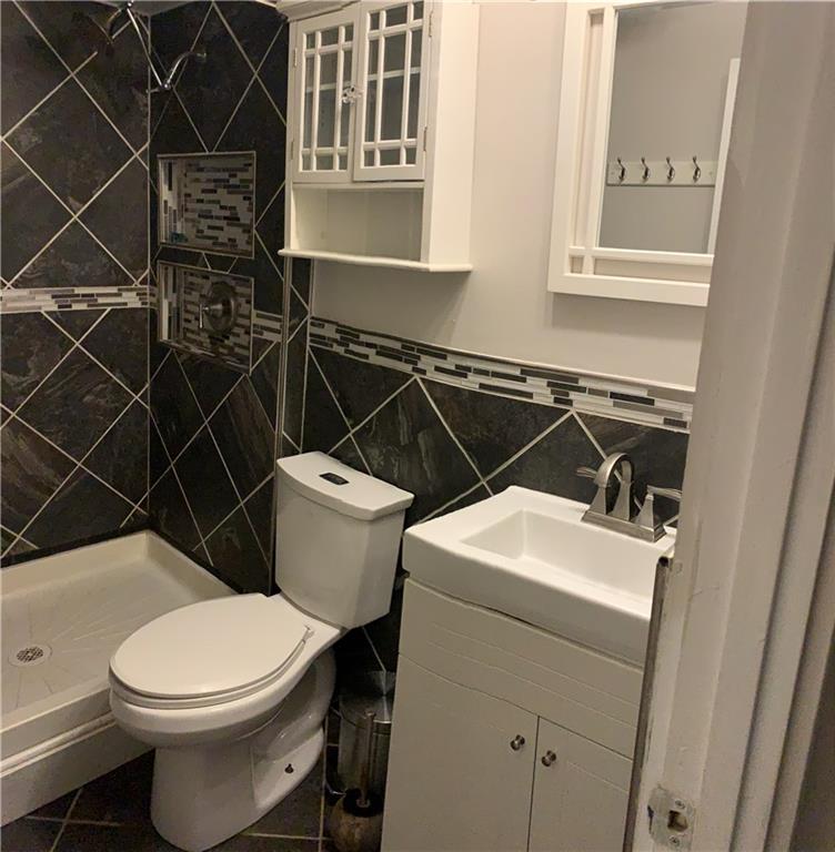 5708 Walnut Street, Unit G1 Pittsburgh, PA 15232 - Photo 11 of 19 Nicely updated, titled bathroom with walk in shower