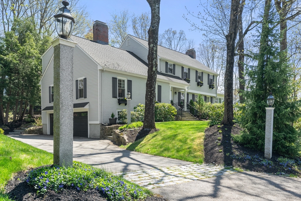 69 Royalston Road Wellesley, MA 02481 - Photo 1 of 31 a front view of a house with garden