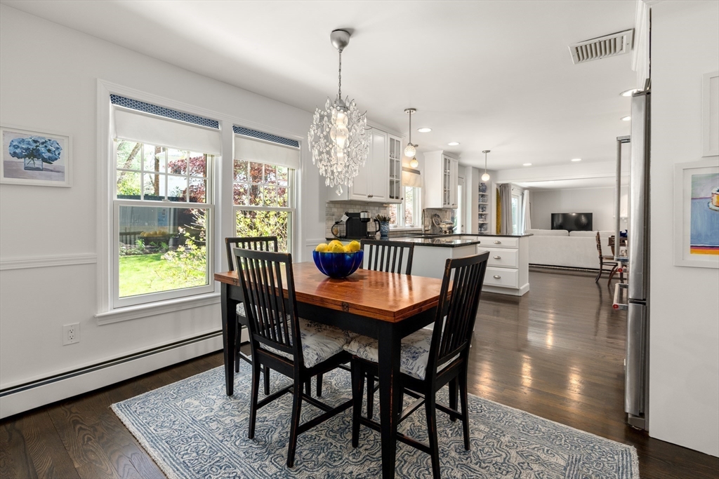 69 Royalston Road Wellesley, MA 02481 - Photo 12 of 31 a dining room with furniture a chandelier and wooden floor