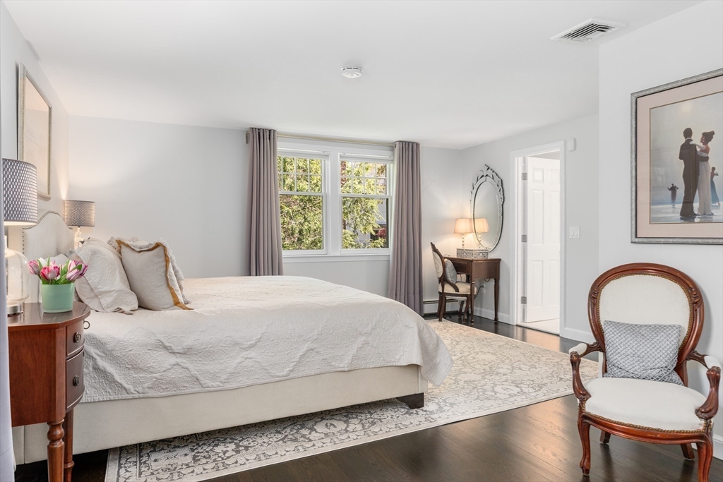 69 Royalston Road Wellesley, MA 02481 - Photo 18 of 31 a bedroom with a bed and a large window