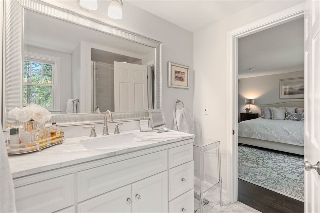 69 Royalston Road Wellesley, MA 02481 - Photo 20 of 31 a en suite bathroom with double sink and a mirror