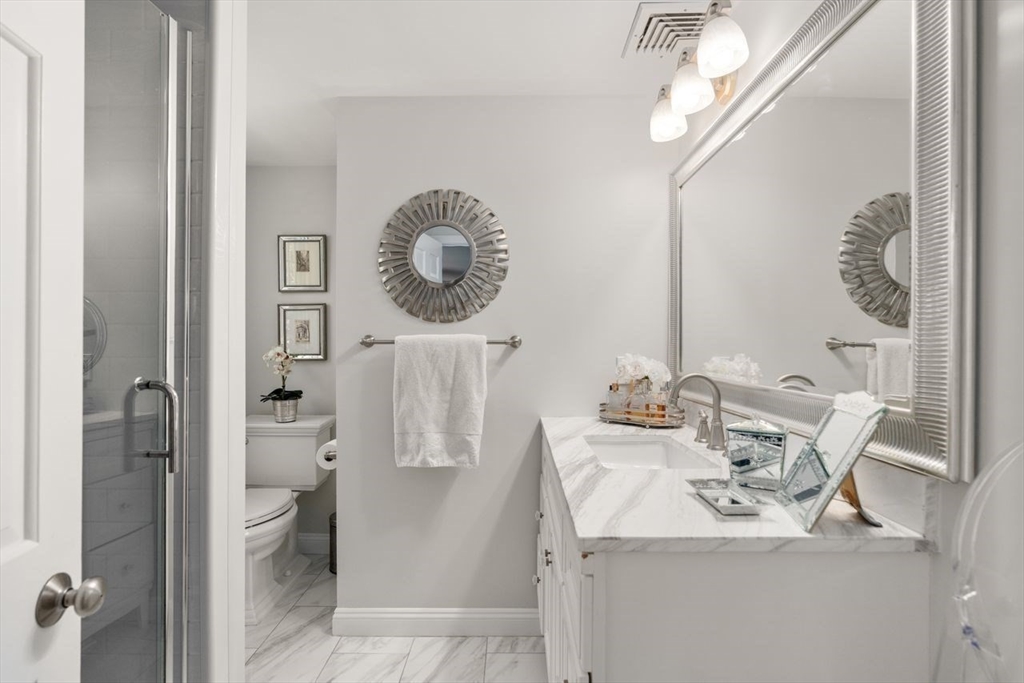 69 Royalston Road Wellesley, MA 02481 - Photo 21 of 31 a bathroom with a sink mirror and toilet