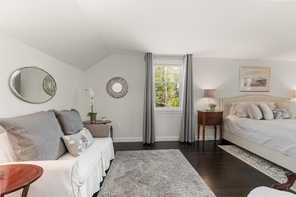 69 Royalston Road Wellesley, MA 02481 - Photo 22 of 31 a bed room with a bed mirror and a window