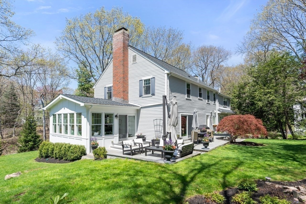 69 Royalston Road Wellesley, MA 02481 - Photo 26 of 31 a view of a house with a yard porch and sitting area