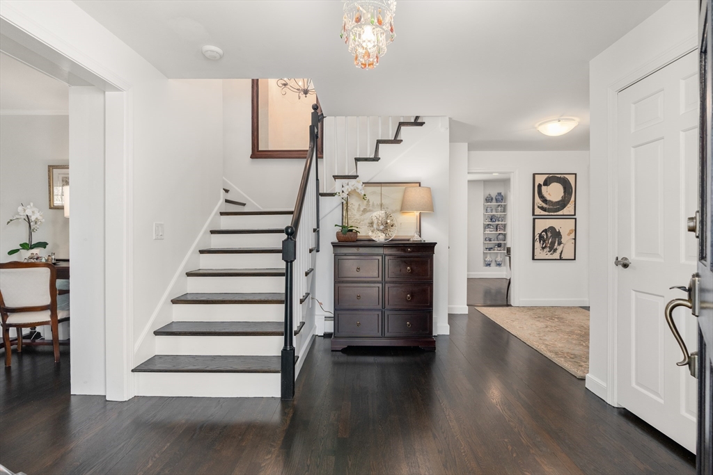 69 Royalston Road Wellesley, MA 02481 - Photo 3 of 31 a view of a hallway with wooden floor and workspace