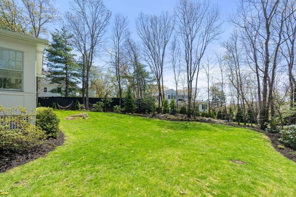 69 Royalston Road Wellesley, MA 02481 - Photo 31 of 31 a view of a backyard with large trees