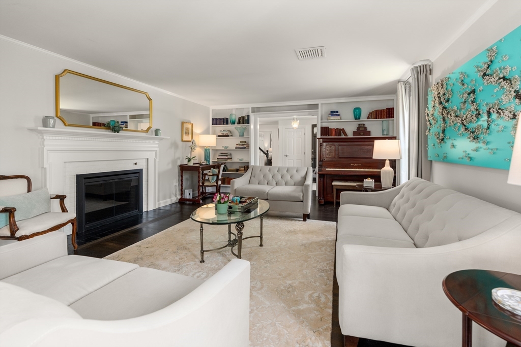 69 Royalston Road Wellesley, MA 02481 - Photo 6 of 31 a living room with furniture and a fireplace