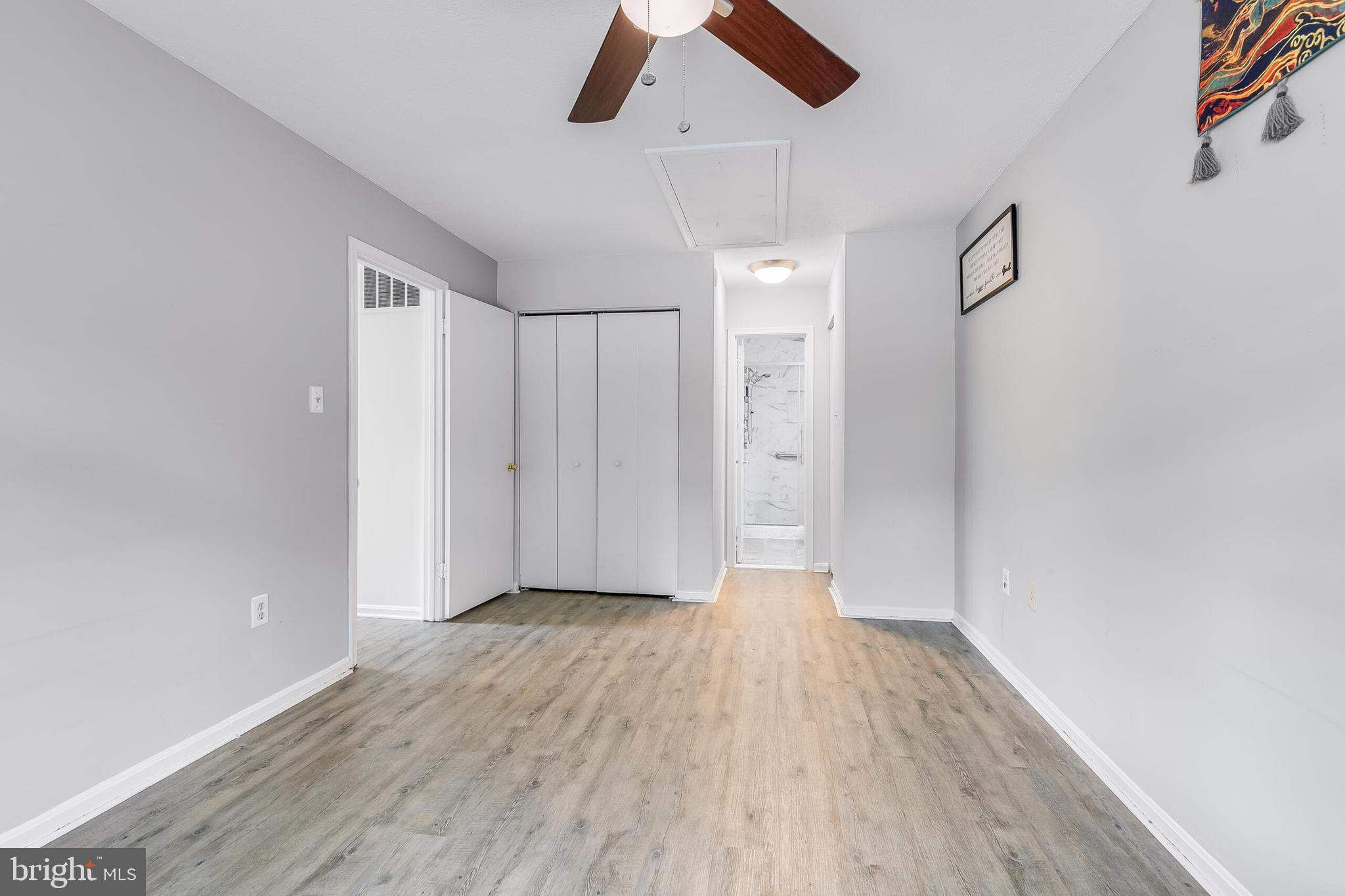 7329 Split Rail Lane Laurel, MD 20707 - Photo 21 of 32 a view of empty room with wooden floor and ceiling fan