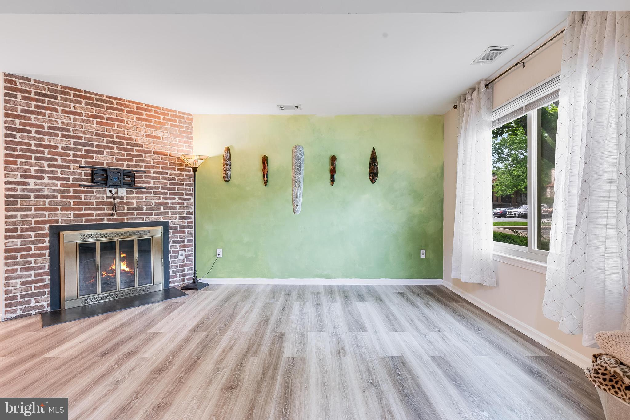 7329 Split Rail Lane Laurel, MD 20707 - Photo 4 of 32 a view of empty room with windows and fireplace