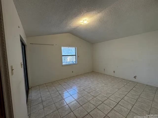 a view of a hallway with a window