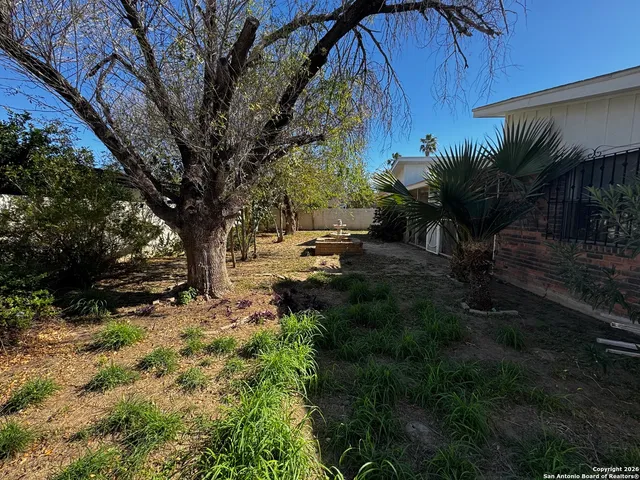 a backyard of a house with lots of green space