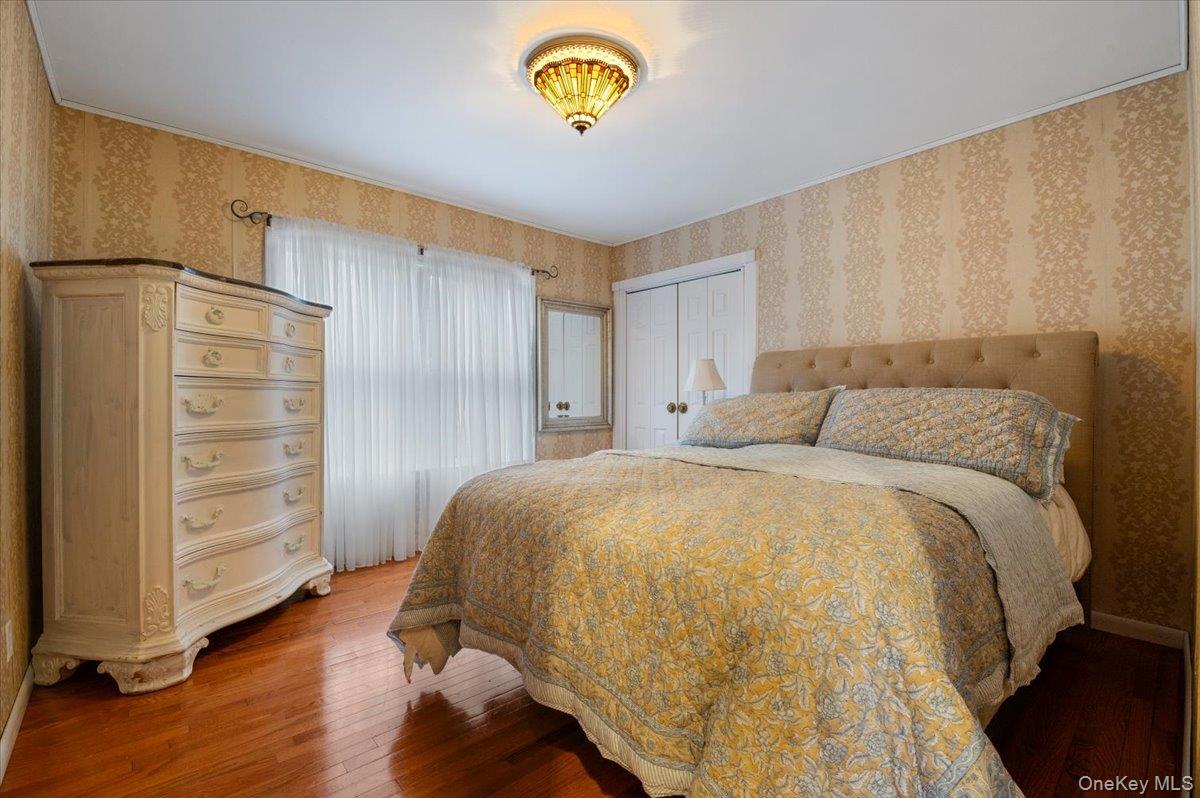 33 Fleets Cove Road Huntington, NY 11743 - Photo 23 of 44 a bedroom with a bed and a window