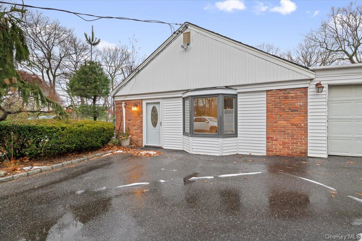 33 Fleets Cove Road Huntington, NY 11743 - Photo 24 of 44 a view of a house with a street