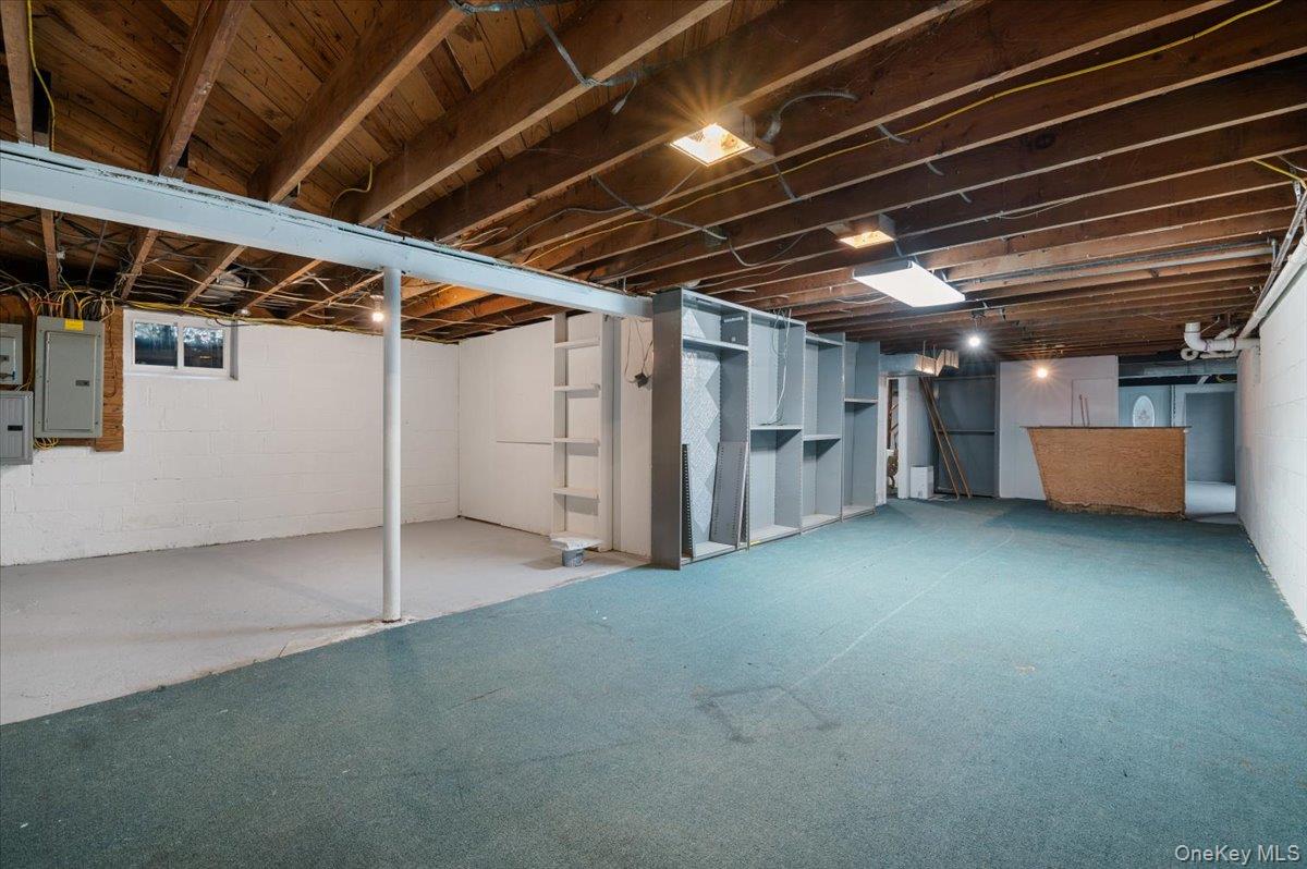 33 Fleets Cove Road Huntington, NY 11743 - Photo 37 of 44 a view of empty room with wooden ceiling