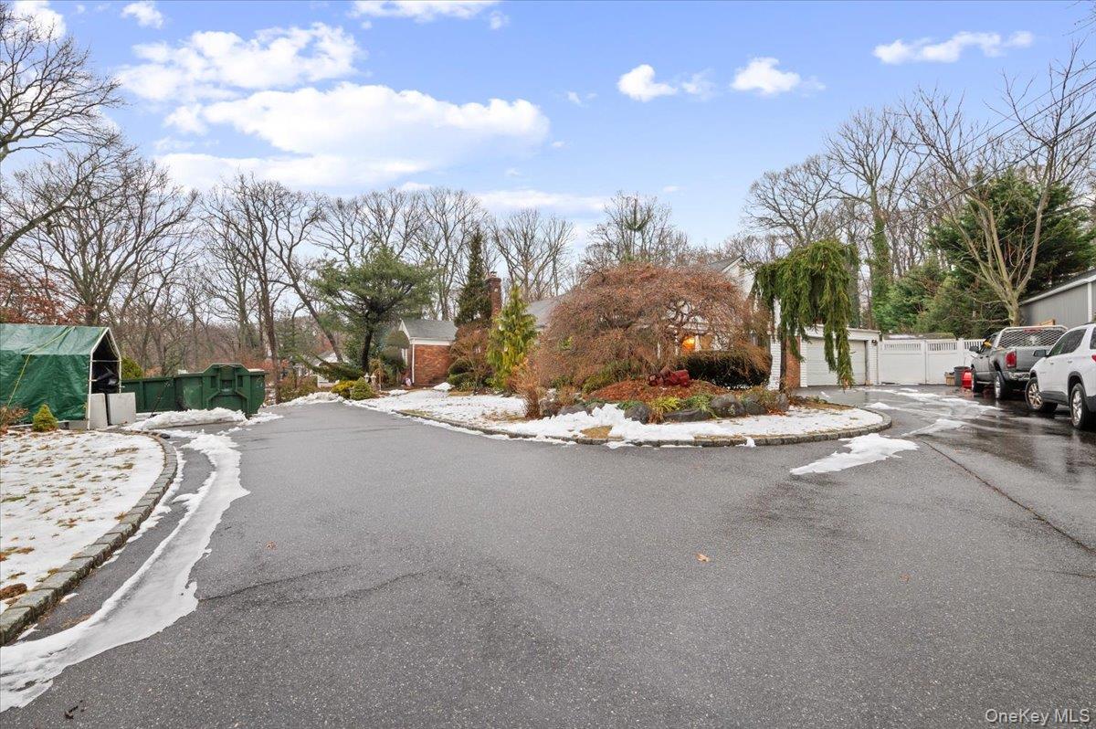 33 Fleets Cove Road Huntington, NY 11743 - Photo 39 of 44 a view of road with a building and trees