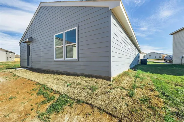 a house view with a backyard space