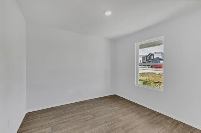a view of an empty room and window