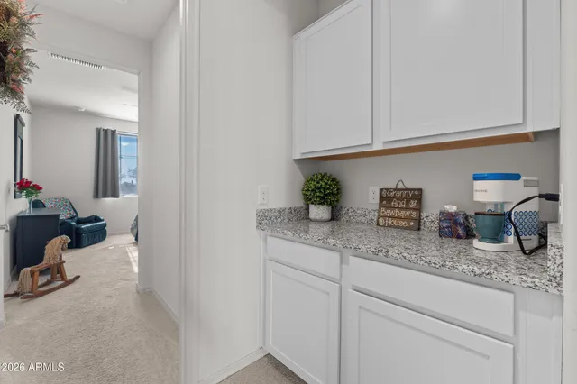 a living room with couches and large window