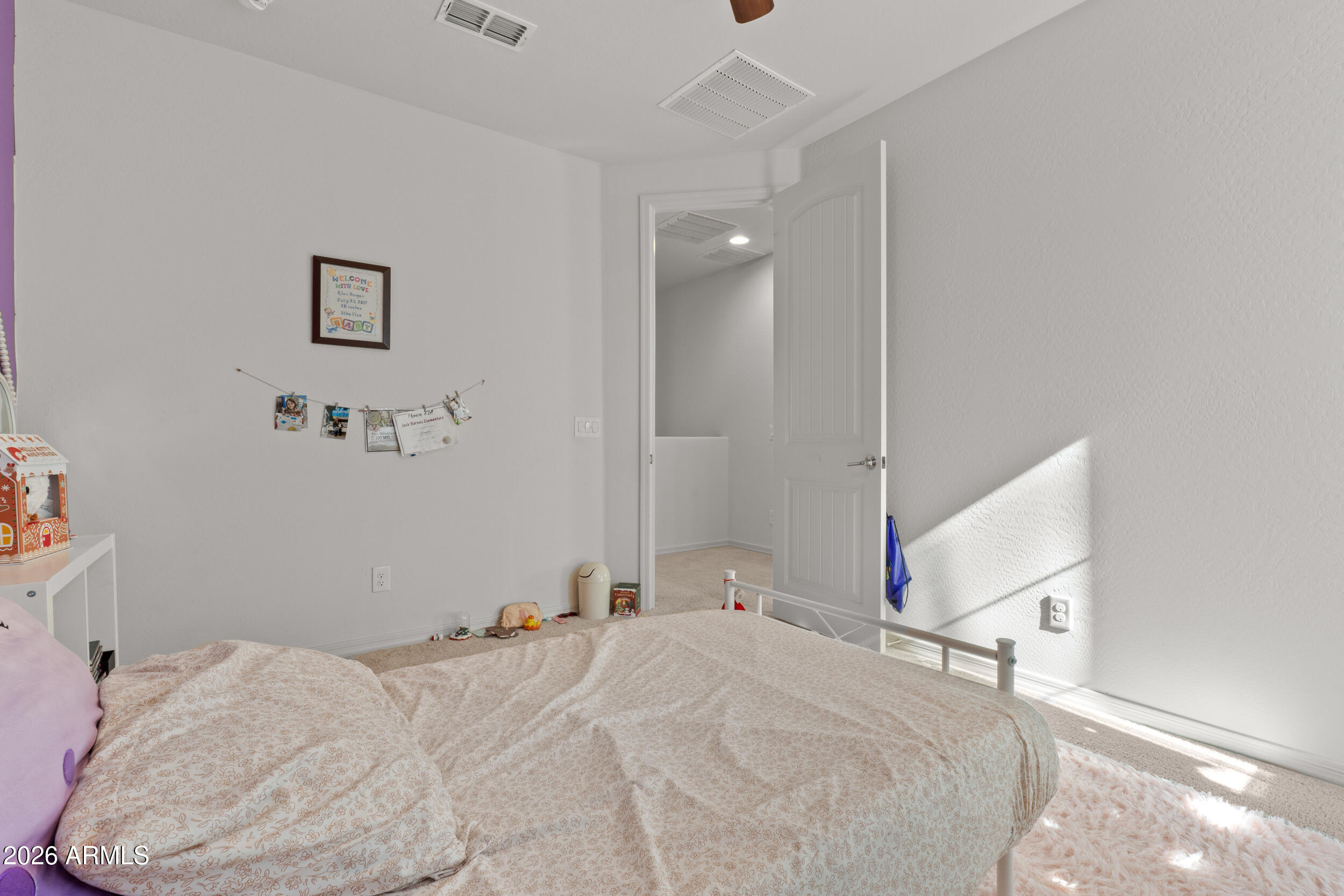 22978 East Pummelos Road Queen Creek, AZ 85142 - Photo 36 of 46 a bedroom with a bed and a window