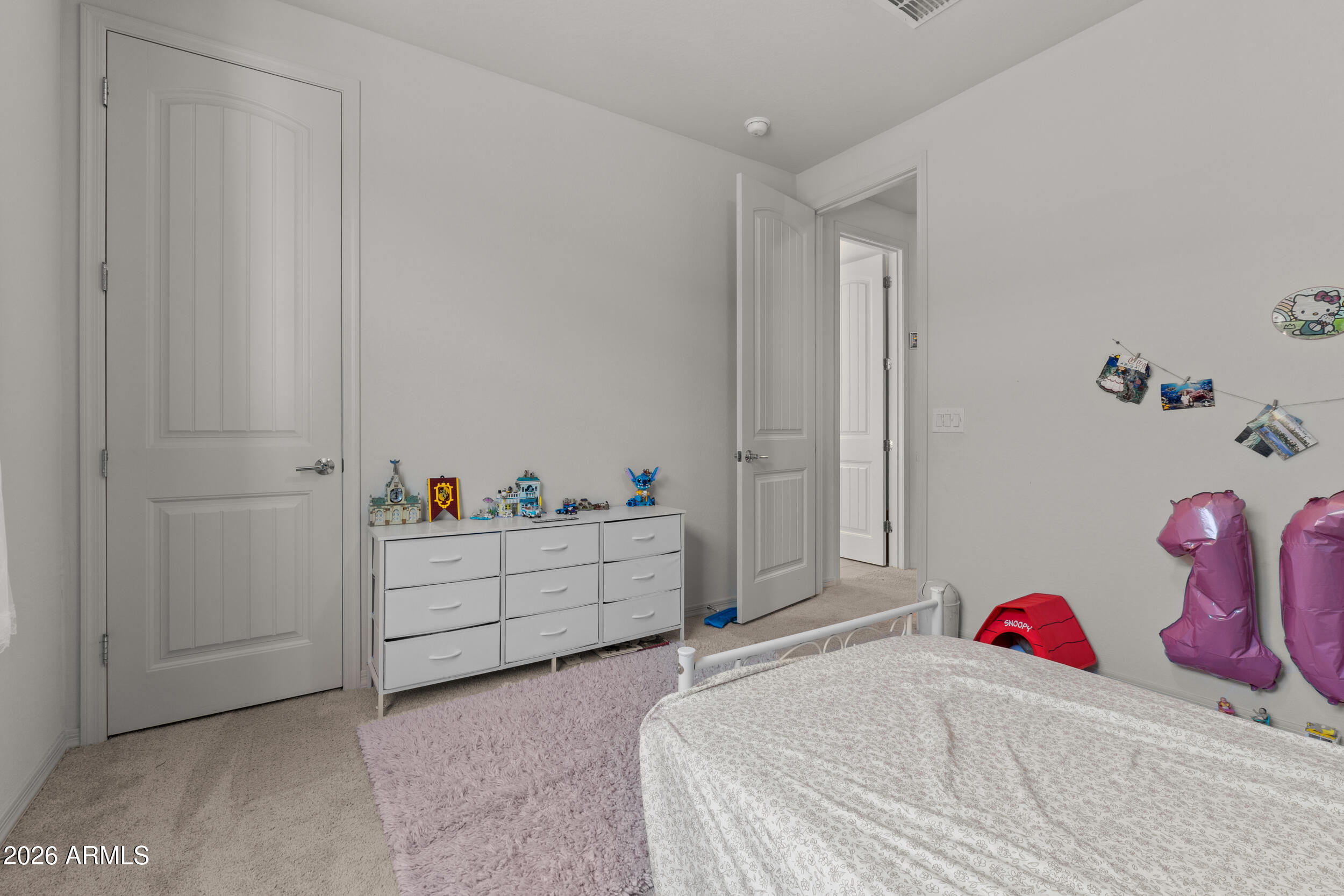 22978 East Pummelos Road Queen Creek, AZ 85142 - Photo 39 of 46 a bedroom with a bed and a cabinets