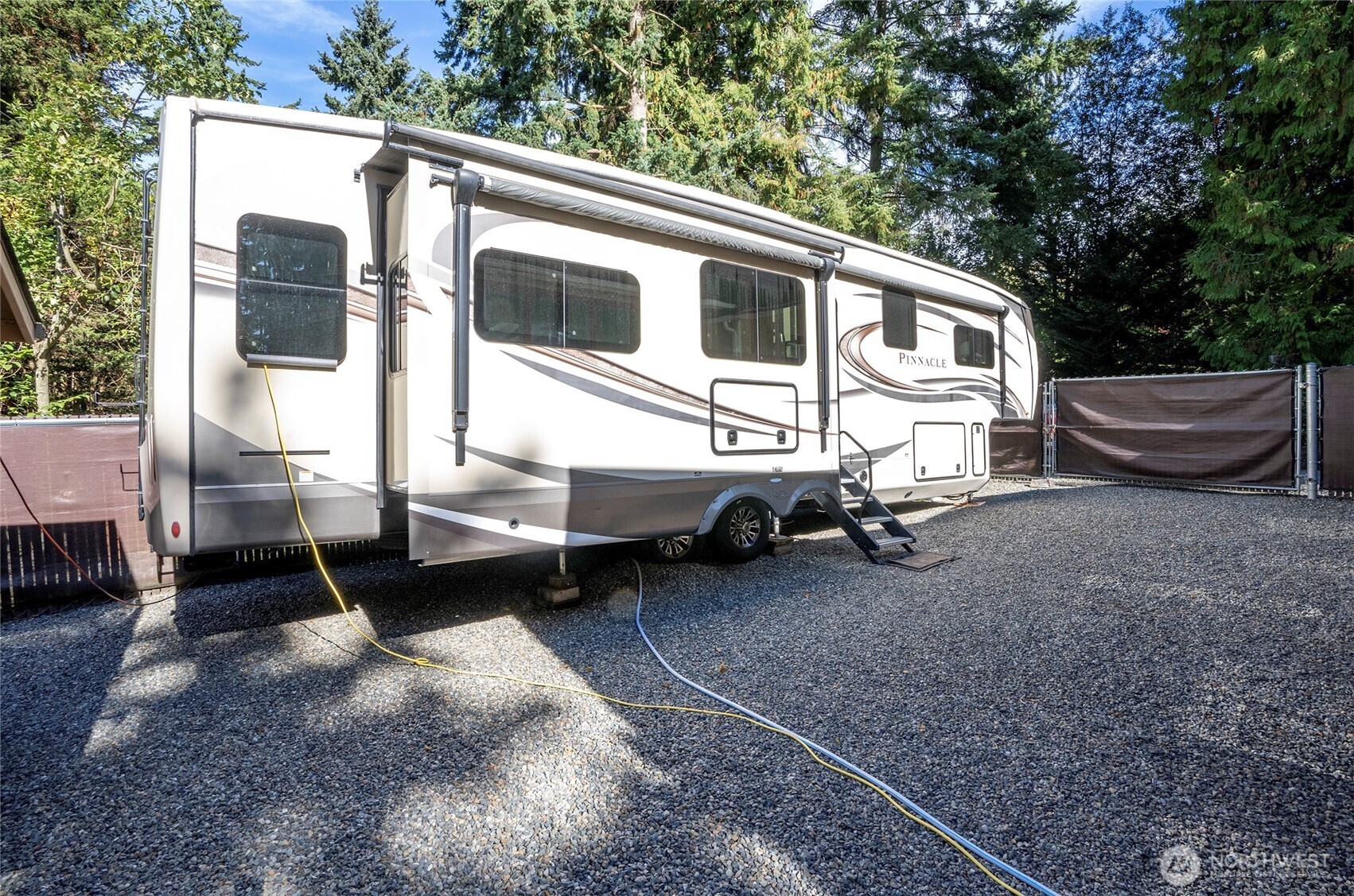 33507 43rd Avenue Southwest Federal Way, WA 98023 - Photo 11 of 40 a view of a blue house with a yard and lawn chairs