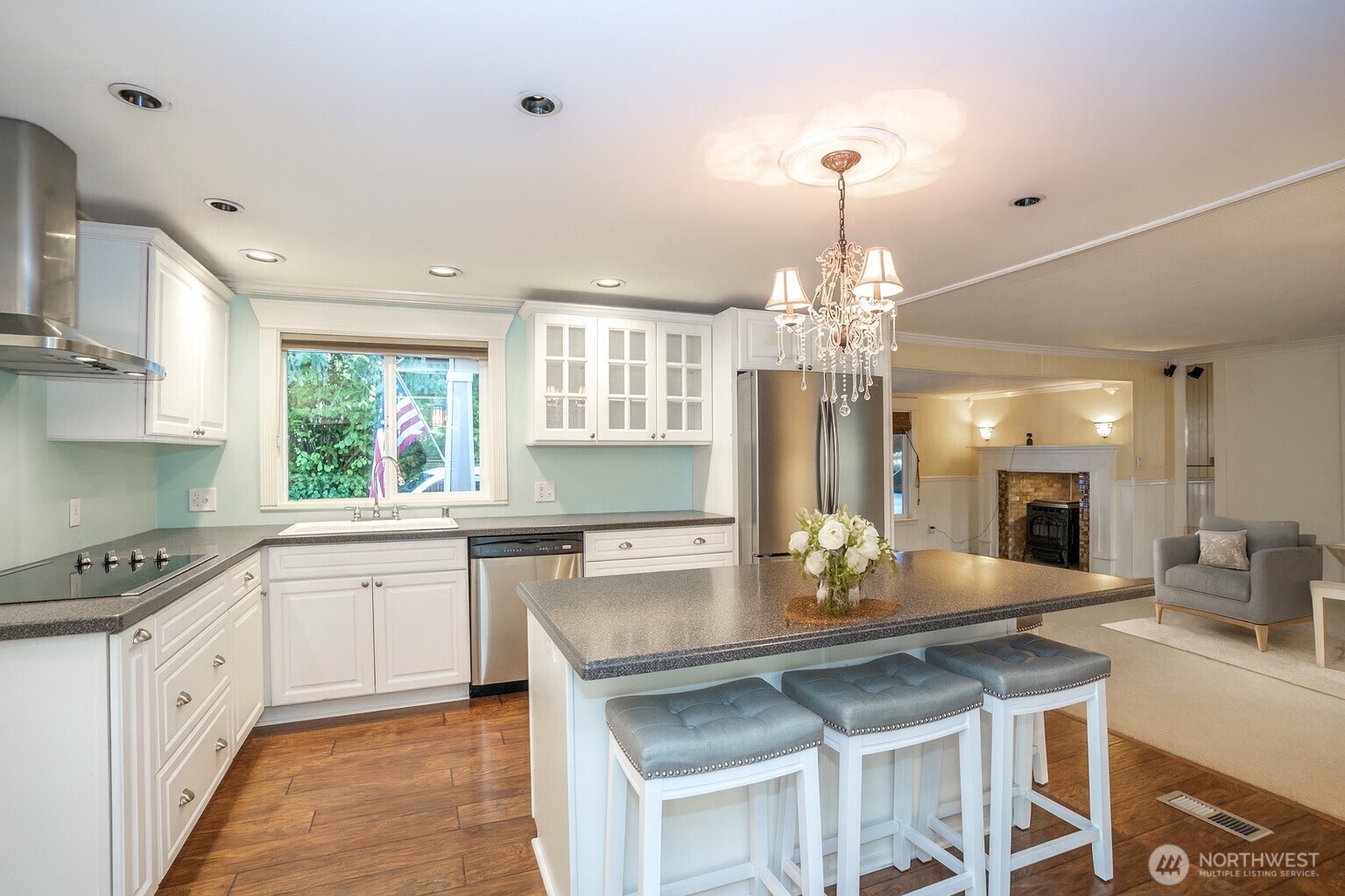 33507 43rd Avenue Southwest Federal Way, WA 98023 - Photo 16 of 40 a kitchen with a center island wooden cabinets and white appliances