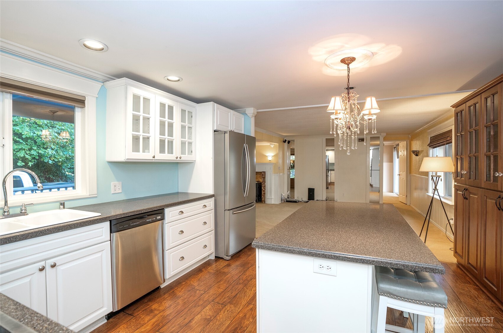 33507 43rd Avenue Southwest Federal Way, WA 98023 - Photo 17 of 40 a kitchen with a sink a center island a stove cabinets and a chandelier